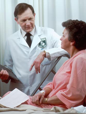 A doctor examining a patient in a warden