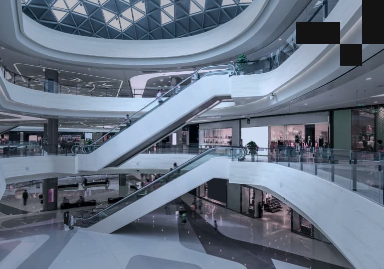 People do shopping in a three-floor mall