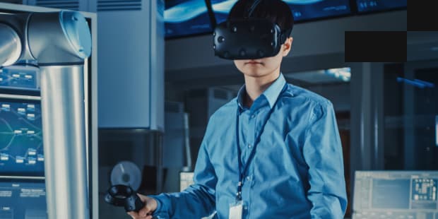 A person in a shirt wearing a VR headset and controllers