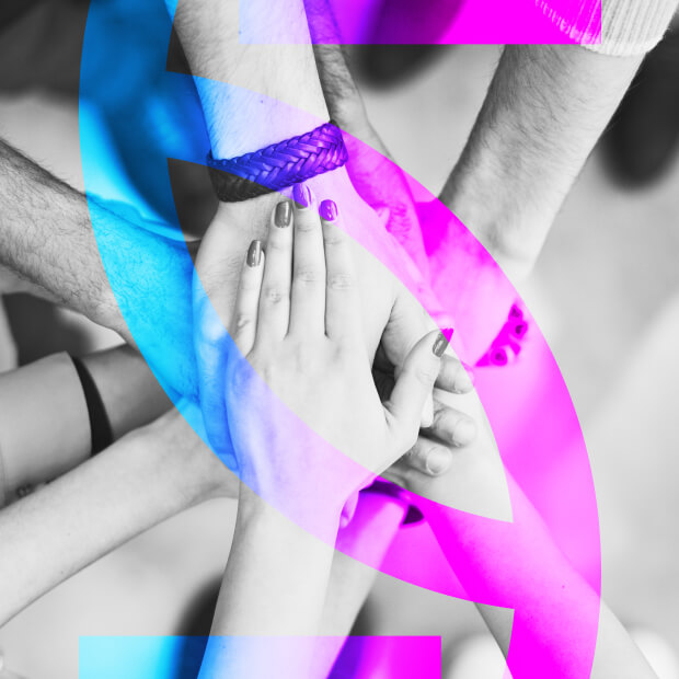 The group of people joined hands next to the StreamSettle logo