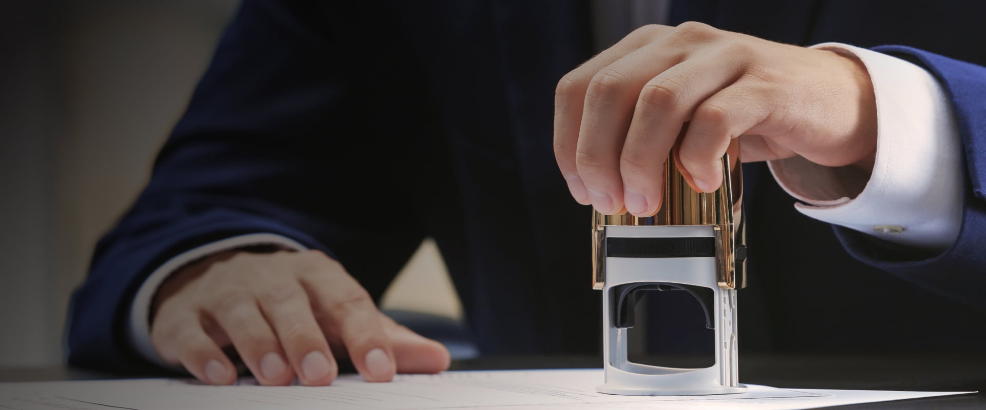 A person setting his seal to a document