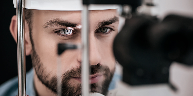 A human eye being analyzed by retina diagnostics device