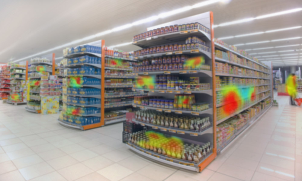Shelves in a grocery store with red and yellow zones illustrating customers' buying habits