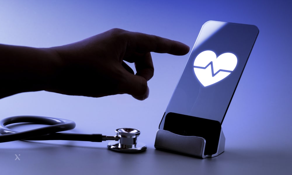 A hand holding a phone that shows conditions of a human body