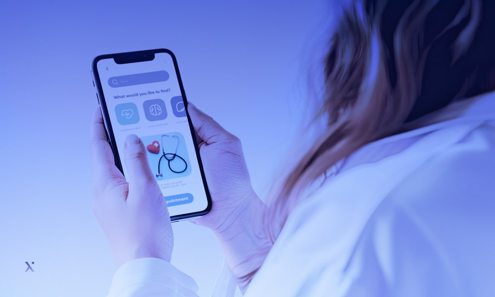 A hand holding a phone with the icon of a microscope on the screen