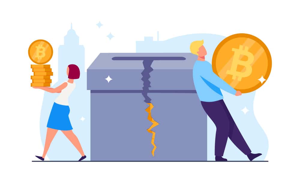 Two people next to a damaged charity box with bitcoins inside