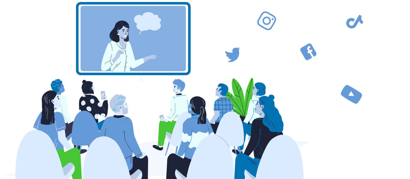 Audience sitting before a screen with an influencer