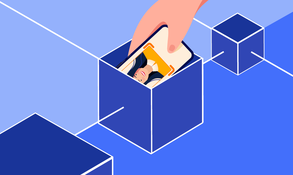 A person putting a mobile phone into a box symbolizing blockchain