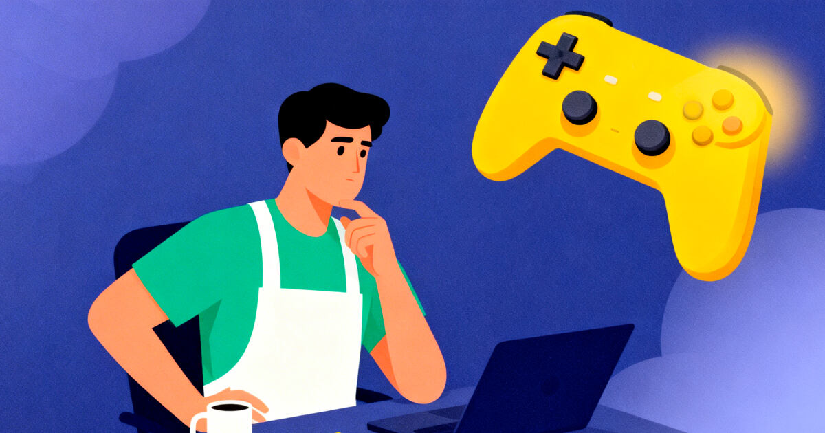 A person working on a laptop and a game controller near him