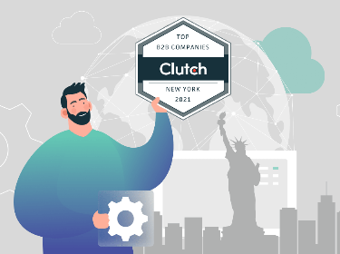 A person holding Clutch Top B2B Companies badge on New York background