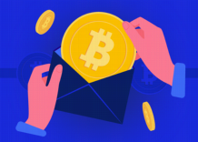A person gets Bitcoin out of an envelope