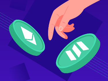 A human hand touching Ethereum and Solana tokens