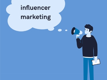 A person holds a loudspeaker and says 'influencer marketing'