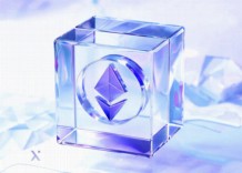 A crystal cube featuring a logo, reflecting light and showcasing its geometric design.