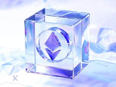 A crystal cube featuring a logo, reflecting light and showcasing its geometric design.