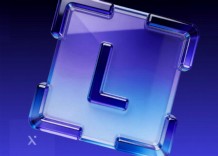 A blue and purple glass letter L displayed against a neutral background.