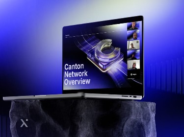 A laptop computer displayed on a pedestal against a solid blue background.