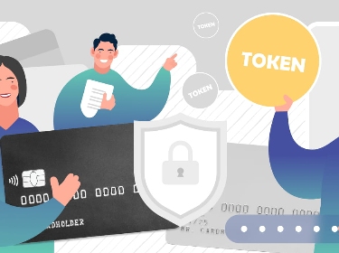 People holding a token, credit card, and a document